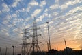 Electricity pylons and power lines, at sunset Royalty Free Stock Photo