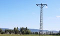 Electricity pylons, power pole high voltage transmission towers sky background Royalty Free Stock Photo