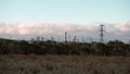 Electricity Pylons in Serene Landscape Royalty Free Stock Photo