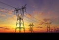Electricity pylons at sunset Royalty Free Stock Photo