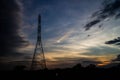 Electricity pylons at sunset Royalty Free Stock Photo