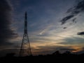 Electricity pylons at sunset Royalty Free Stock Photo