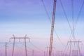 Electricity pylons transmission towers with overhead power lines in countryside Royalty Free Stock Photo