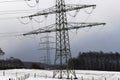 Electricity pylons in a winter landscape Royalty Free Stock Photo