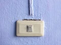 Electricity switch on blue wall background Royalty Free Stock Photo