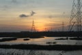 An electricity tower, power transmission tower during sunset