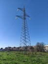 Electricity tower pylon near the city skyline