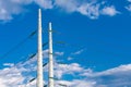 Electricity towers against a blue sky. Royalty Free Stock Photo