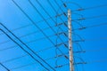 Electricity towers against a blue sky. Royalty Free Stock Photo