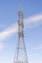 Electricity transmission power lines on the sky background. High voltage towerare on the blue. Electric power line in sunny cloudy Royalty Free Stock Photo