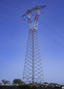 Electricity transmission power lines at sunset High voltage tower Royalty Free Stock Photo