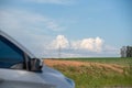 Electricity transmission tower and in the background cumolunimbus clouds on the blue horizon