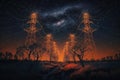 Electricity transmission towers with orange glowing light at night, created with Generative AI technology Royalty Free Stock Photo