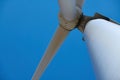 Electricity wind generator on bright cloudy sky background - wind energy and technology concept