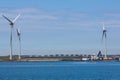 Electricity Windmill and dredging ships Royalty Free Stock Photo