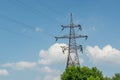 Electricity wires power tower in the field during bright sunny summer day Royalty Free Stock Photo