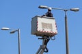 Electricity worker works next to a street light