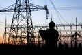 Electricity workers and pylon Royalty Free Stock Photo