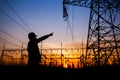 Electricity workers and pylon silhouette Royalty Free Stock Photo