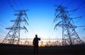 electricity workers and pylon silhouette Royalty Free Stock Photo