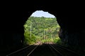 View through a railway tunnel with diverging routes ahead. Royalty Free Stock Photo