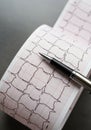 Electrocardiogram (ECG) printout with a black and silver pen resting on it. The paper Royalty Free Stock Photo
