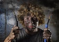 Electrocuted man with cable smoking after domestic accident with dirty burnt face shock electrocuted expression