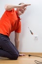 Electrocuted man repairing socket