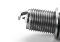 The electrode on the new iridium spark plug. Close up. Isolated on a white background Royalty Free Stock Photo