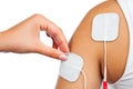 Electrodes of tens device on shoulder, tens therapy, Royalty Free Stock Photo