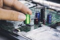 Electrolytic capacitor in the hand Royalty Free Stock Photo