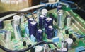 Electrolytic capacitor row on electronic circuit board Royalty Free Stock Photo