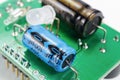 Electrolytic capacitors and LED diode on a printed circuit board Royalty Free Stock Photo