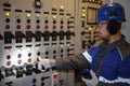 electromechanic in electrical safety gloves holds power cable, cabling connection of high voltage power electric line in