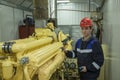 Electromechanic performs repair work on a diesel generator