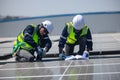 Electromechanical solar panel technician install, assemble photovoltaic systems on roof based on site assessment and schematic