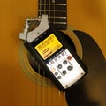 Electronic audio device - Top view Portable digital Recorder guitar background Royalty Free Stock Photo