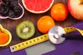 Electronic bathroom scale, centimeter and stethoscope, healthy food, slimming and healthy lifestyles concept Royalty Free Stock Photo