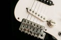 Electronic black and white bass guitar close up. Guitar as a symbol of yin yang Royalty Free Stock Photo