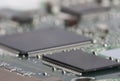 Electronic board. The board features elements: chips, diodes, capacitors, chokes. Shallow depth of field. Royalty Free Stock Photo
