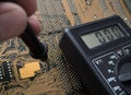 Electronic board and multimeter Royalty Free Stock Photo