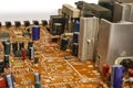 Electronic board with radio components, connectors, slots and processor chip from an electronic device, close-up Royalty Free Stock Photo