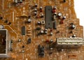 Electronic board with radio components, connectors, slots and processor chip from an electronic device, close-up Royalty Free Stock Photo