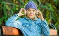 Electronic book concept. relax in park. hipster girl with mp3 player. listening music in park. hipster woman in Royalty Free Stock Photo