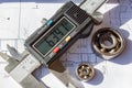 Electronic caliper and used ball bearings closeup