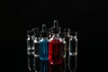 Electronic cigarette liquids on black background Royalty Free Stock Photo