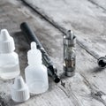 Electronic cigarette on old wooden table Royalty Free Stock Photo