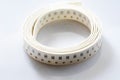 Electronic component on white background. SMD components in black plastic carrier tape with copyspace Royalty Free Stock Photo