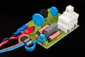 Electronic components of electric motor supply module on black background