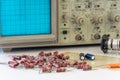 Electronic components with oscilloscope on white table Royalty Free Stock Photo